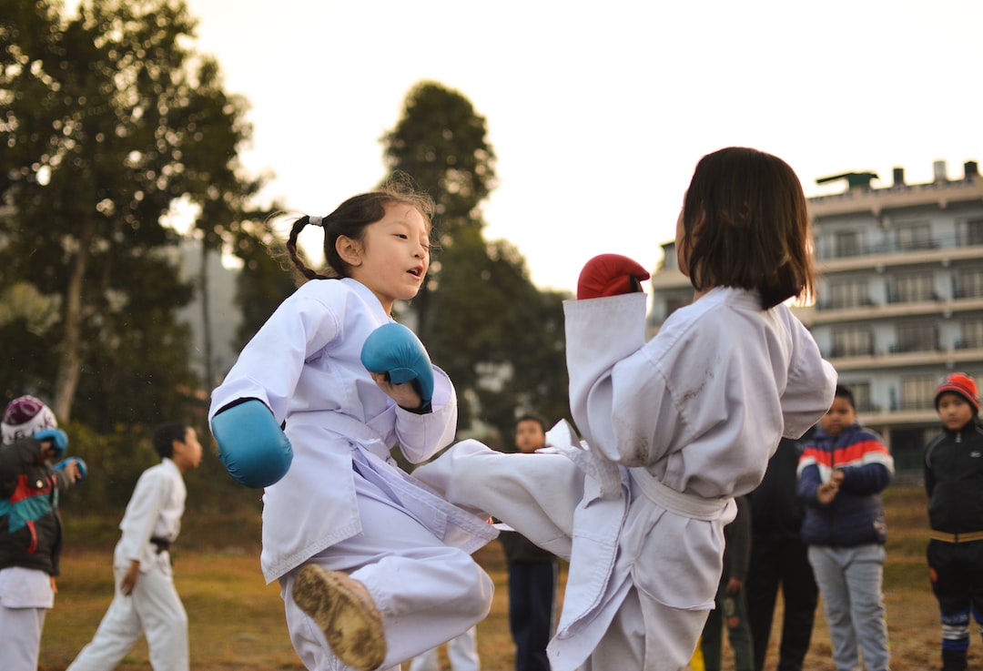 children participating in martial art sparring