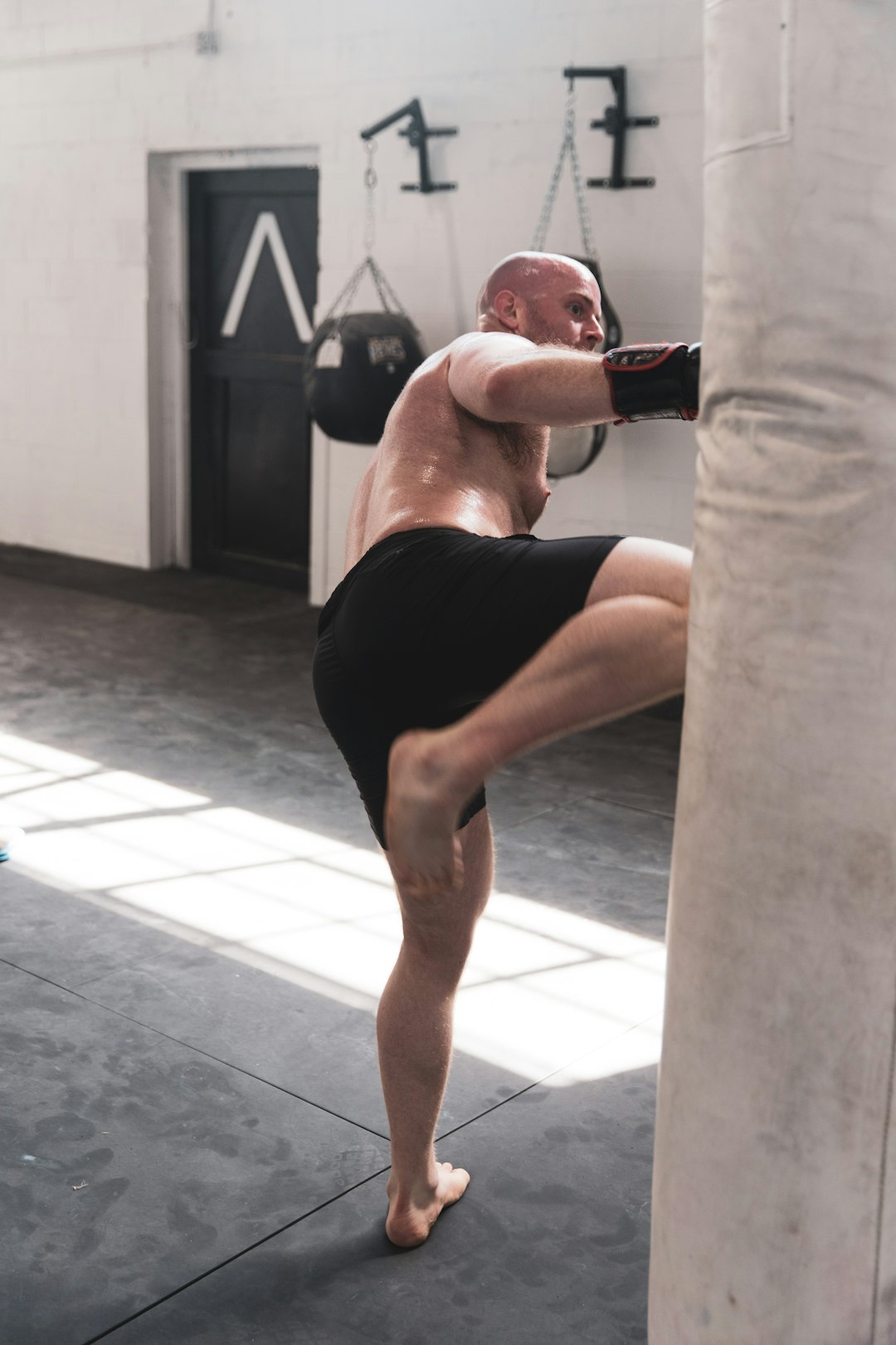 PORTRAITS INSTAGRAM - @LGNWVRPRTRTS 
EDITORIAL INSTAGRAM - @LGNWVRPHTO 
PERSONAL INSTAGRAM - @LGNWVR by MMA Ninja man in black shorts and red boxing gloves