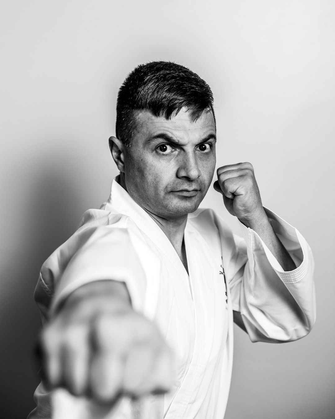 FAQ by MMA Ninja man in white dress shirt